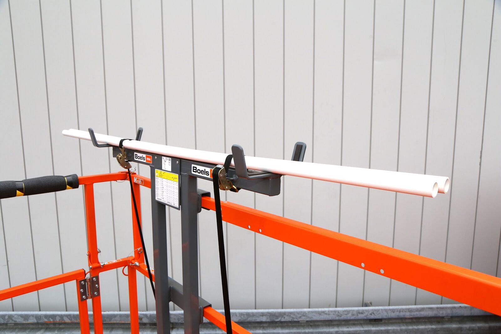 Pipe racks for electrical scissor lifts